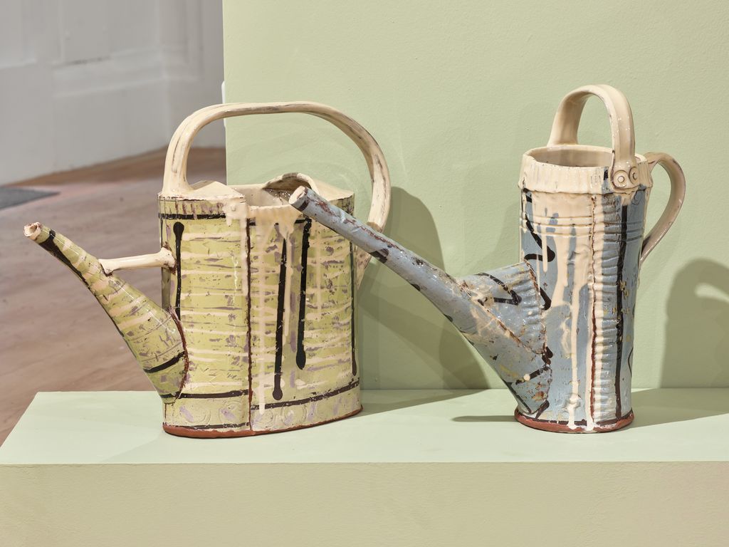 Image may contain Tin Can Axe Device Tool Weapon Watering Can Accessories Bag and Handbag