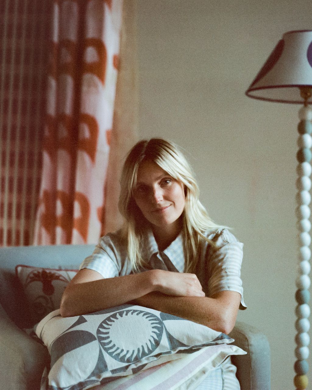 Image may contain Christelle Lefranc Face Happy Head Person Smile Blonde Hair Lamp Teen Sitting and Home Decor