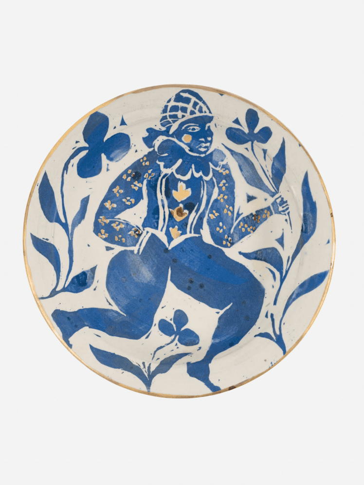 Image may contain Art Porcelain Pottery Food Meal Dish Plate Face Head Person and Platter