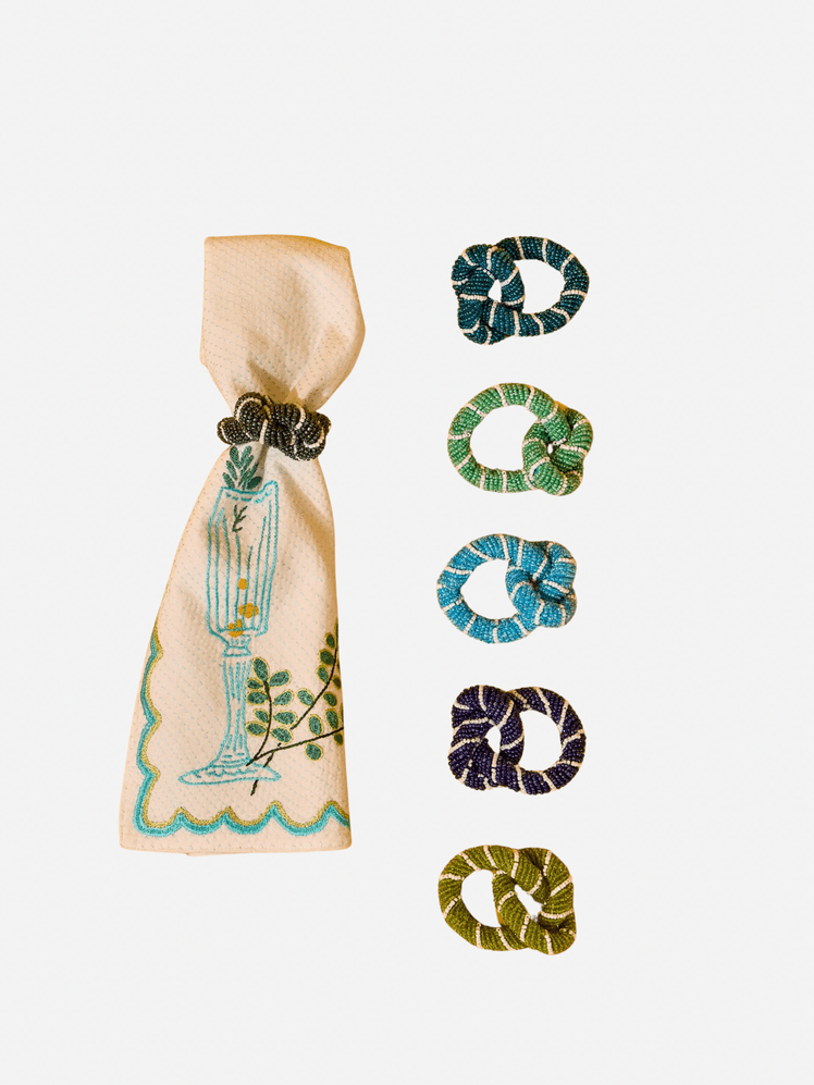 Image may contain Clothing Scarf Accessories Earring Jewelry Animal Reptile and Snake